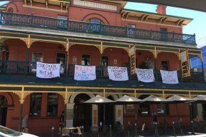 Some of the offensive banners which have forced the Brass Monkey Hotel into issuing an apology. 