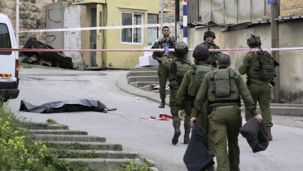 Israeli soldiers near the body of Abdel Fattah al-Sharif, who was shot and killed by Sergeant Elor Azaria in March.