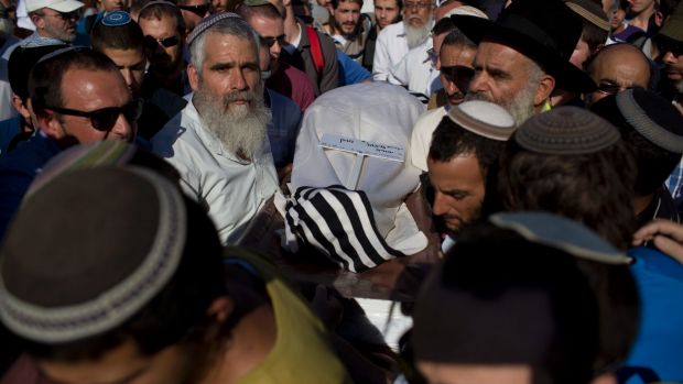 Israeli mourners carry the body of Miki Mark at his funeral in Jerusalem in July. Mark was killed in a shooting attack ...