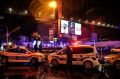 Policemen secure the area after an attack on Reina, a popular night club in Istanbul.