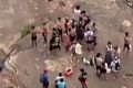 Police and bystanders at Mermaid Pools in Tahmoor on Friday afternoon.