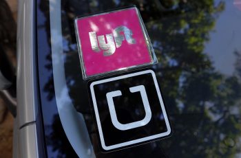 A vehicle with both Lyft and Uber windshield decals is parked Monday afternoon Dec. 14, 2015, near Fisherman's Wharf in San Francisco, Calif. (Karl Mondon/Bay Area News Group)