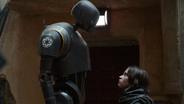 Robot K-2SO (left, with Felicity Jones as Jyn Erso) is the undisputed star in the latest Star Wards installment. A sign ...