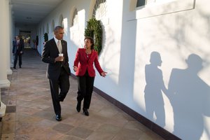 President Barack Obama walks with National Security Advisor Susan E. Rice on the Colonnade of the White House, Dec. 7, 2016.