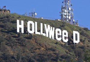 The Hollywood sign is seen vandalized Sunday, Jan. 1, 2017. Los Angeles residents awoke New Year's Day to find a prankster had altered the famed Hollywood sign to read "HOLLYWeeD."