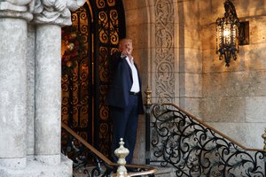 President-elect Donald Trump points to reporters at Mar-a-Lago, Wednesday, Dec. 28, 2016, in Palm Beach, Fla.