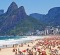 Colorful beach umbrellas and bathers on Ipanema beach, Rio de Janeiro, Brazil