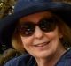 Birgitta Sharpe sits near a Sweedish flag as she and friends wait for others to join the group for a picnic lunch in ...