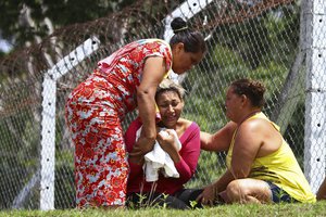 The wife of a prisoner who was killed in a riot cries outside Anisio Jobim Penitentiary Complex in Manaus, Brazil, Monday, Jan. 2, 2017.