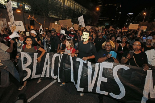 Marchers numbering nearly 1,000 take to the streets to protest against the recent fatal shootings of black men by police Friday, July 8, 2016, in Phoenix. Freeway ramps were closed and pepper spray and tear gas were used Friday night during a protest in downtown Phoenix following the killings of black men in Baton Rouge, Louisiana, and suburban St. Paul, Minnesota, at the hands of police and the deadly sniper attack on police officers in Dallas. (AP Photo/Ross D. Franklin)