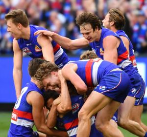 Sweet victory. The Bulldogs celebrate their grand final win over the Swans.