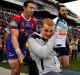 An emotional Alex McKinnon is wheeled onto Hunter Stadium in 2014.