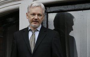 In this Feb. 5, 2016 file photo, WikiLeaks founder Julian Assange speaks from the balcony of the Ecuadorean Embassy in London. Assange will be interviewed about Swedish sex crime allegations at the Ecuadorean Embassy in London on Monday, Nov. 14, 2016.