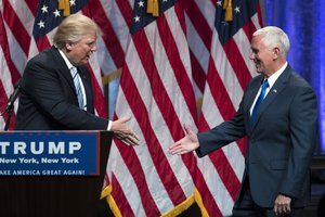 Republican presidential candidate Donald Trump, left, shakes hands with Gov. Mike Pence, R-Ind., during a campaign event to announce Pence as the vice presidential running mate on, Saturday, July 16, 2016, in New York.