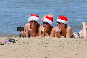 Christmas Day on st Kilda beach where the temperature has hit 36 degrees. 