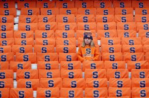 Syracuse fan Gabrielle Wild, 9, of Syracuse, N.Y., watches warm ups before an NCAA college basketball game between ...