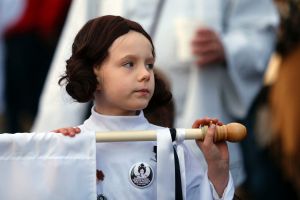 Addy Longlois, 7, dressed as Princess Leia, walks in a parade in honor of actress Carrie Fisher, who played Princess ...