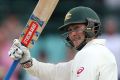 Matt Renshaw raises his bat after making 150.