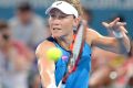 Outmuscled: Samantha Stosur of Australia plays a backhand against Garbine Muguruza.