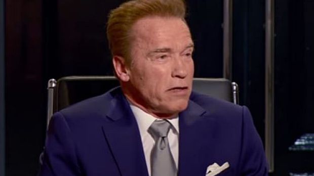 'I'm the boss': Arnold Schwarzenegger takes Donald Trump's chair.