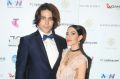 Lisa Origliasso and Logan Huffman pose in awards room during the 30th Annual ARIA Awards 2016 at The Star on November ...