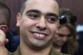 Sergeant Elor Azaria waits with his parents for the verdict inside the military court in Tel Aviv.