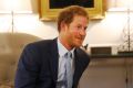 Prince Harry speaks after presenting U.S. Staff Sergeant Elizabeth Marks' gold medal to members of the medical team from ...