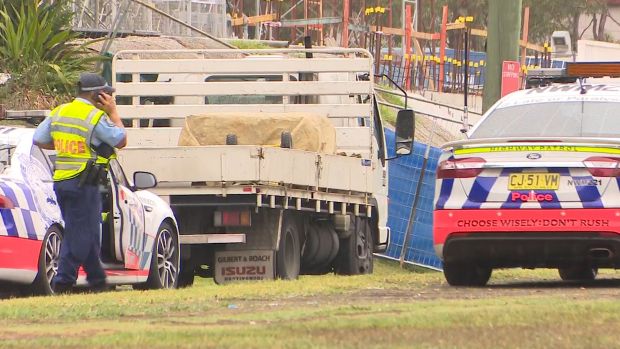 The scene where a truck driver who was pulled over by police on a road in Sydney's west got out of his rig only to be ...