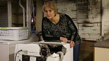 Phoebe Teitzel's in her laundry at her Glenhaven home. her washing machine caught on fire. She was told last year her ...