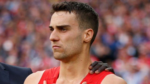 Xavier Richards (right) and Aliir Aliir commiserate after last year's grand final.