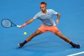 Roger Federer stretches to play a forehand to Alexander Zverev of Germany during the men's singles match on day four of ...