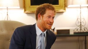 Prince Harry speaks after presenting U.S. Staff Sergeant Elizabeth Marks' gold medal to members of the medical team from ...