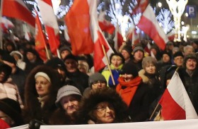 Supporters of Poland's ruling Law and Justice party, which is showing signs of ignoring international criticism, at a ...