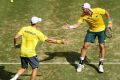 Solid start: Peers and Groth celebrate winning the first set.