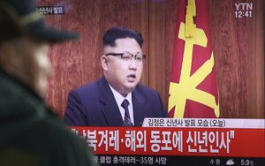 A South Korean man watches North Korean leader Kim Jong Un delivering his New Year's speech on a TV news program shown at the Seoul Railway Station in Seoul, South Korea, Sunday, Jan. 1, 2017.