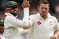 Josh Hazlewood celebrates the dismissal of Sharjeel Khan on Wednesday.