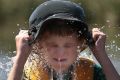 Chapman's Dylan Kirsten, 11, cools off in Lake Burley Griffin.