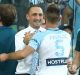 Ivan Franjic celebrates with Melbourne City interim coach Michael Valkanis after scoring at AAMI Park on Friday night.