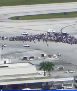 People were evacuated onto the tarmac at Fort Lauderdale Airport following reports of a shooting inside the terminal. 