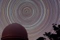 Star trails around the south celestial pole above the Australian Astronomical Observatory in the Warrumbungle National ...