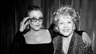 LOS ANGELES, CA - JANUARY 25:  (EDITORS NOTE: THIS IMAGE WAS SHOT IN BLACK & WHITE) Actress Carrie Fisher (L) and ...