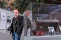 Australian National Aviation Museum chairman Ashley Briggs with a fuel tank that is believed to have belonged to the ...