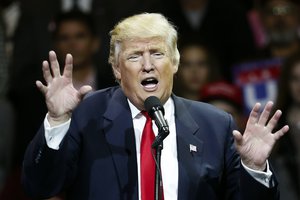 In this Dec. 1, 2016, photo, President-elect Donald Trump smiles as he speaks during the first stop of his post-election tour in Cincinnati. Democrats need to rebuild the political “blue wall” of traditionally Democratic upper Midwest and Great Lakes states that Republican Donald Trump captured with an appeal to white, working-class voters.