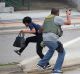 A law enforcement officer evacuates a civilian from an area at Fort Lauderdale.