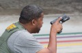 A law enforcement officer evacuates a civilian from an area at Fort Lauderdale?Hollywood International Airport, Friday, ...