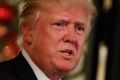 President-elect Donald Trump speaks to reporters at Mar-a-Lago, Wednesday, Dec. 28, 2016, in Palm Beach, Fla. (AP ...