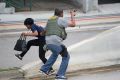 A law enforcement officer evacuates a civilian from an area at Fort Lauderdale.