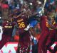 King Carlos: Jubilant teammates mob Carlos Brathwaite after his thunderous hitting won the West Indies the T20 World Cup ...