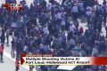 In this still image from video provided by NBC TV Local10, people stand on the tarmac after shots were fired at the ...
