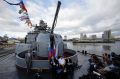 Russia's Ambassador to the Philippines answers questions from reporters beside Russian Admiral during a press conference ...